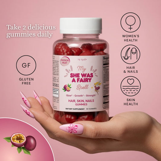 Bottle of My Spell Supplements Hair, Skin, Nails Gummies 'My She Was A Fairy' gummies held in a hand with pink background and product details.