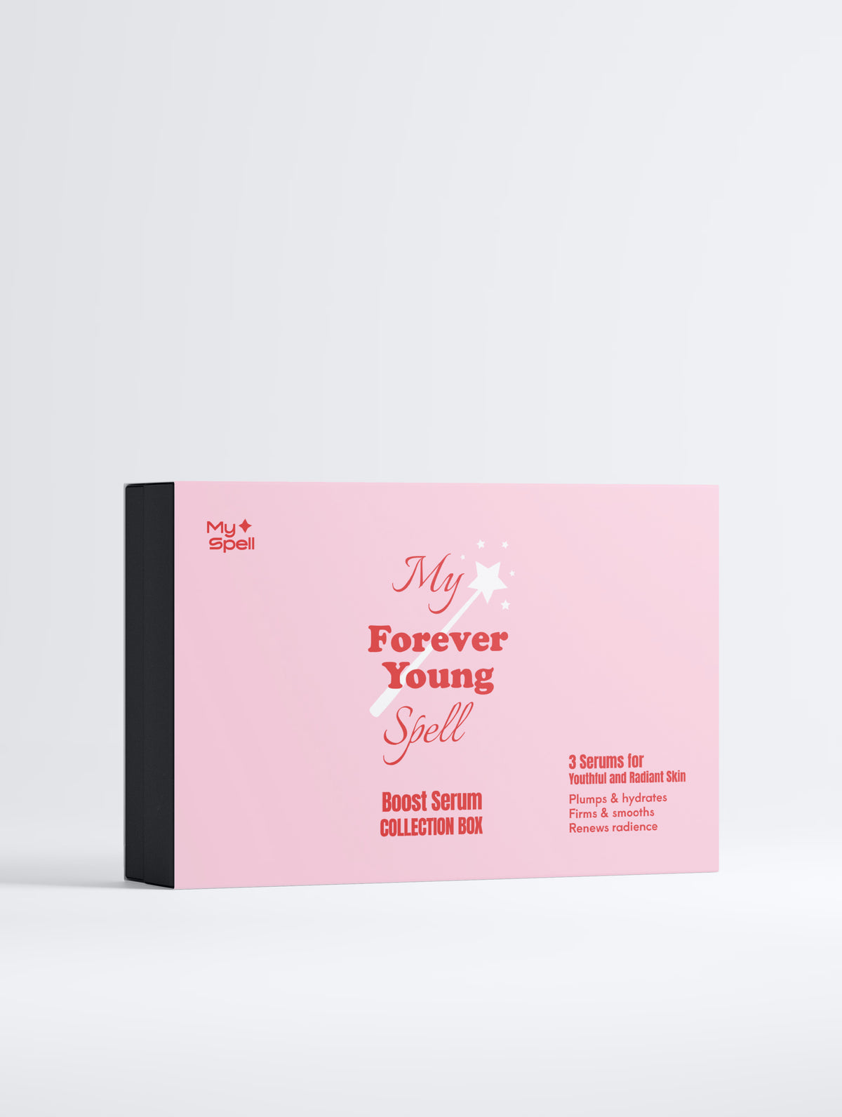 My Spell, pink rectangular product collection box with a black side panel, labeled 'My Forever Young Spell' and 'Boost Serum Collection Box,' photographed on a clean light gray studio background.