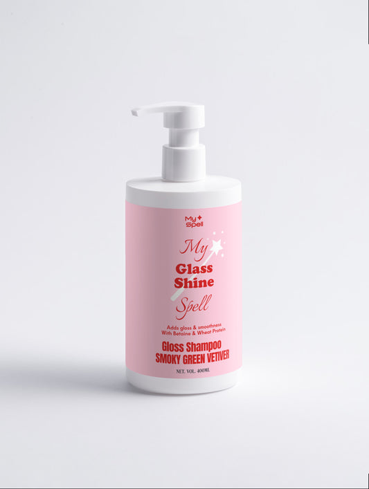 A white pump bottle of My Spell Gloss Shampoo with a pink label, featuring the text 'My Glass Shine Spell' and 'Gloss Shampoo Smoky Green Vetch'.