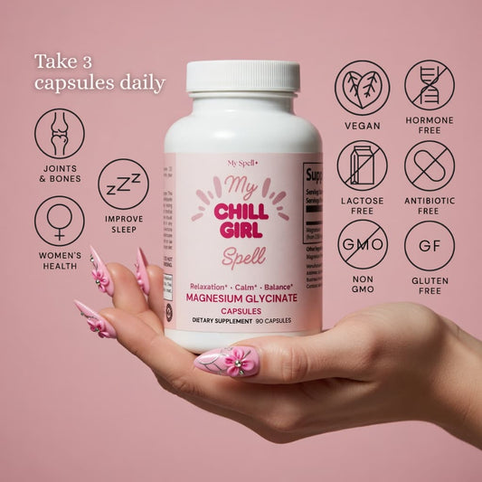 My Spell Supplement bottle labeled 'My Chill Girl Spell' held in a hand with pink nail polish on a pink background.
